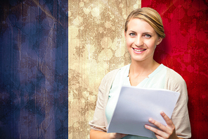 Smiling teacher against france flag in grunge effect