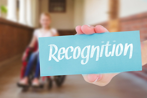 The word recognition and hand showing card against cute pupils writing at desk in library