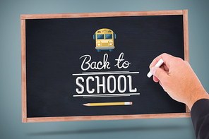 Hand writing with chalk against back to school