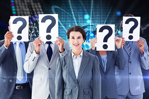 Business colleagues hiding their face with question mark sign against stocks and shares