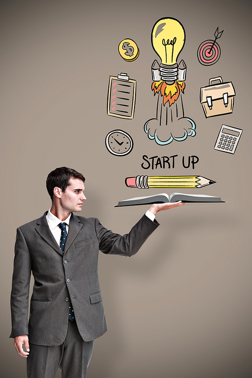 Businessman showing a book against grey background with vignette