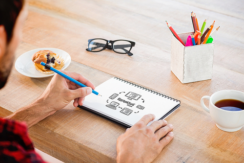 Creative businessman writing notes on notebook against responsive design doodle