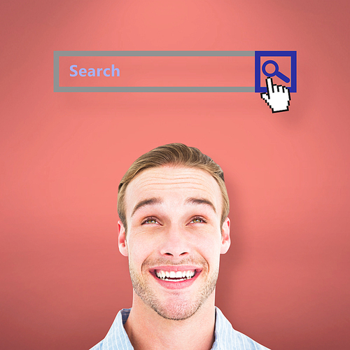 Portrait of smiling man in shirt looking up against pink