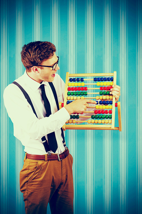 Geeky businessman using an abacus against blue background