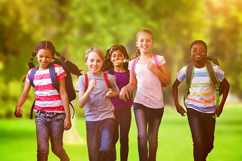 School kids running in school corridor against trees and meadow