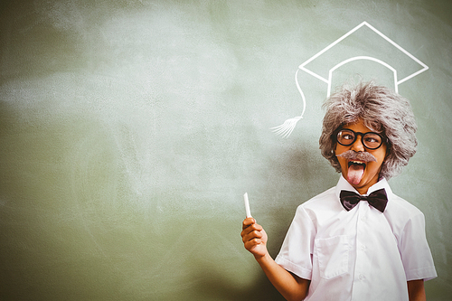 Graduation hat vector against boy dressed as senior teacher in front of blackboard