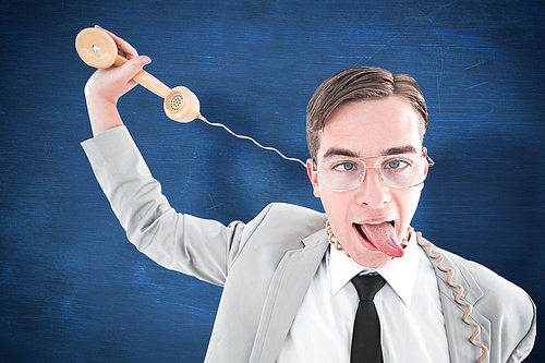 Geeky businessman being strangled by phone cord against blue chalkboard