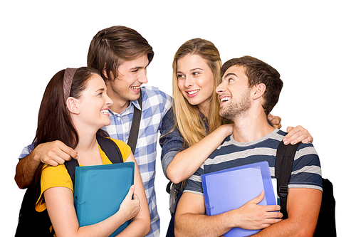 Students holding folders at college corridor against white background with vignette