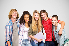 Cheerful college students in library against grey vignette