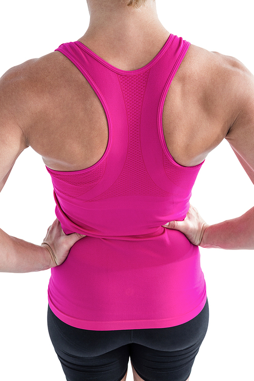 Rear view of muscular woman with hands hips on white background