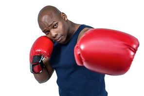 Fit man boxing with gloves on white background