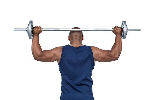 Fit man lifting heavy barbell on white background