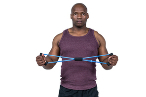 Fit man exercising with resistance band on white background