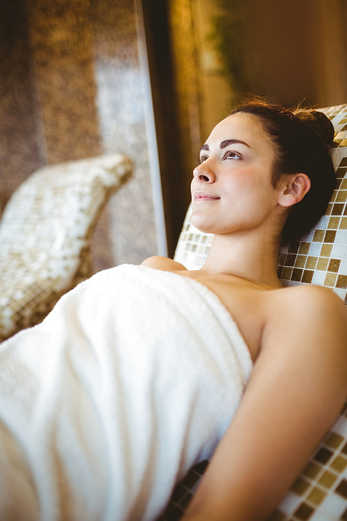 Woman relaxing while lying down at the spa