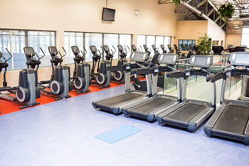 Collection of treadmills and exercise bikes at the gym