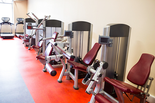 Row of weights machines at the gym