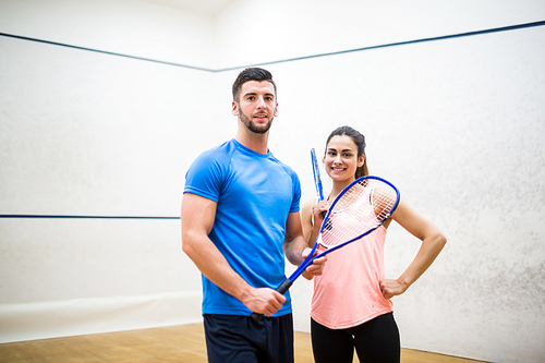 Happy couple after a squash game in the squash court