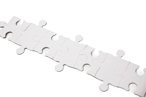 Overhead of jigsaw on white background