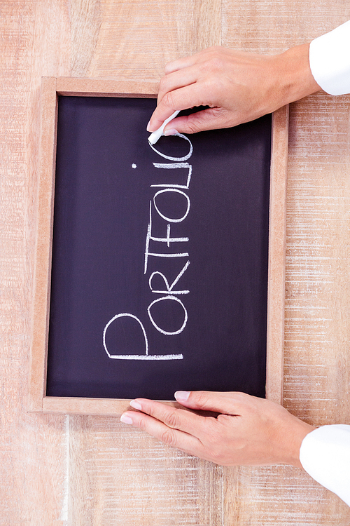Chalkboard on table with portfolio text