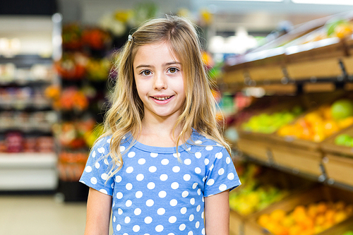 Smiling young girl  at supermarket