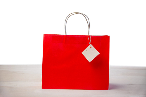 Red shopping gift bag with tag shot in studio