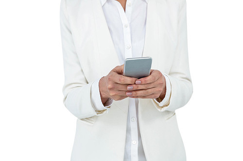 Smiling businesswoman using her smart phone against white background