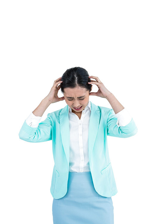 Worried businesswoman holding her head against white background