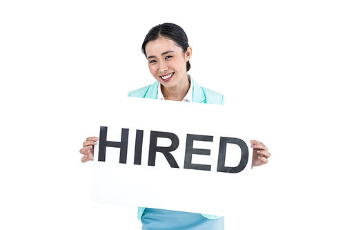 Businesswoman holding a signboard hired against white background