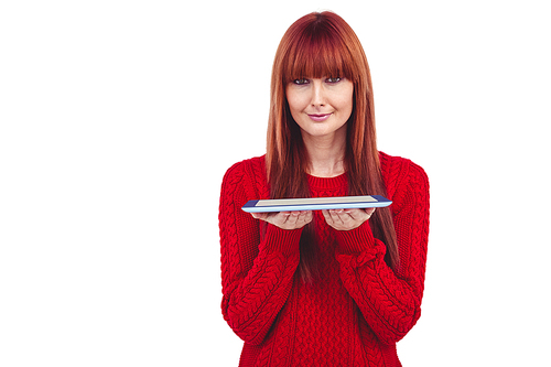 Smiling hipster woman holding tablet against white background