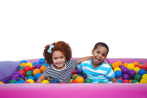 Cute smiling kids in sponge ball pool 