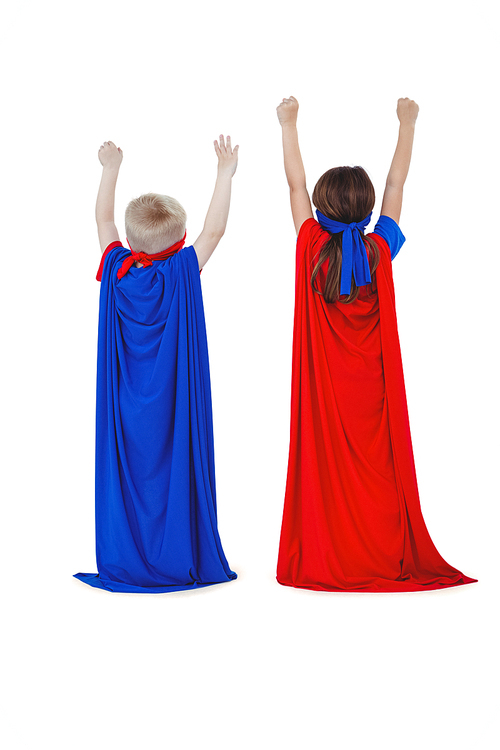 Rear view of masked kids pretending to be superheroes on white screen