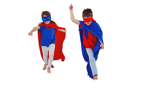 Masked kids walking pretending to be superheroes on white screen