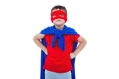 Masked boy pretending to be superhero on white screen