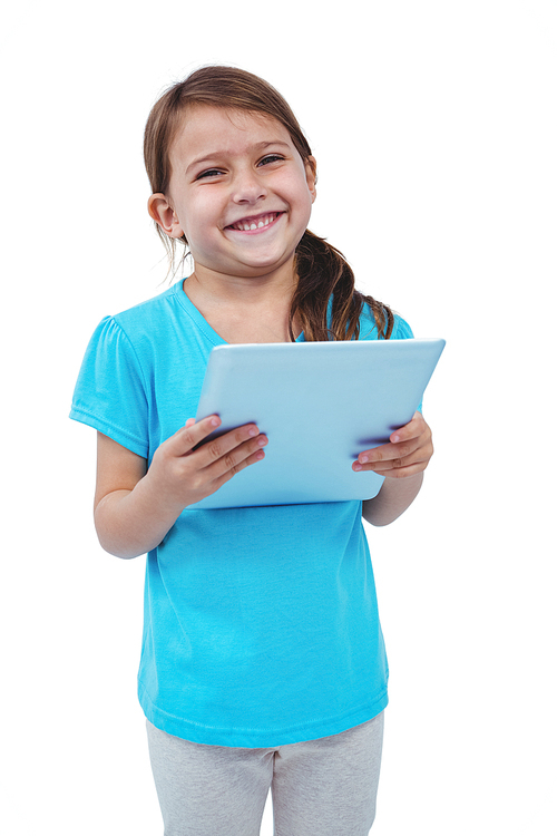 Standing girl using tablet and smiling at the camera on white screen
