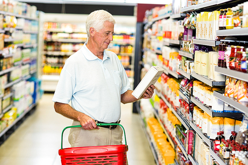 Senior man buying food at the supermarket