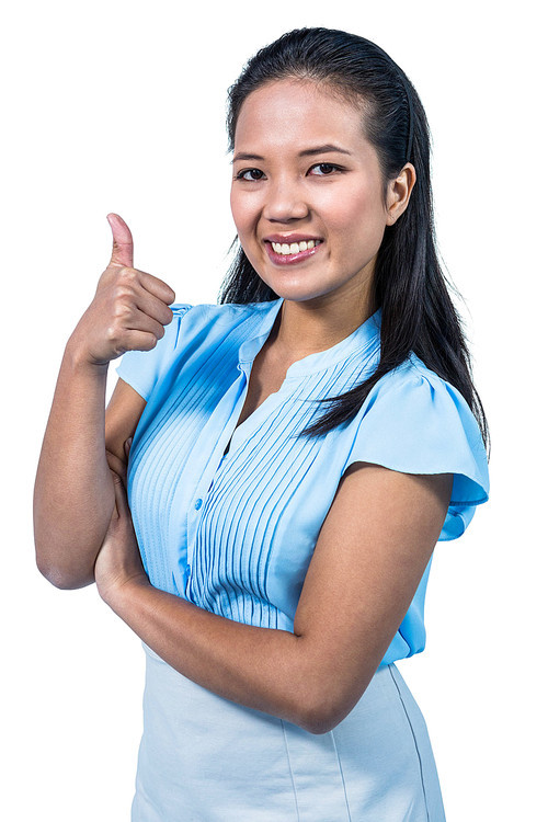 Smiling businesswoman with thumbs up on white background