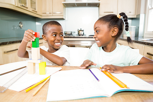 Children doing homework in the kitchen