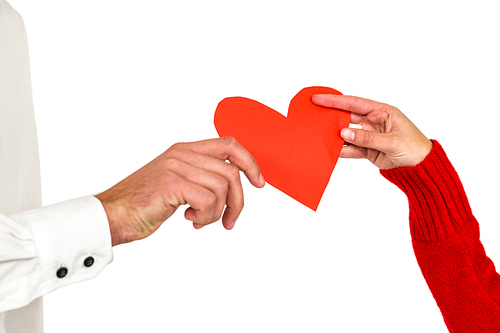Couple hands holding heart shaped paper on white background