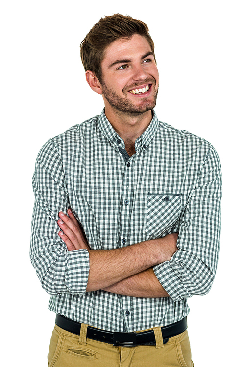 Smiling man with arms crossed on white screen