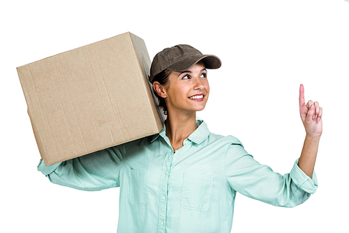 Happy delivery woman holding box pointing up on white screen
