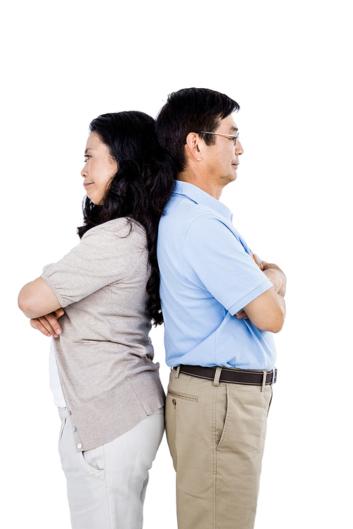 Couple with their backs to each other and arms folded