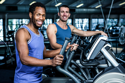 Two men working out together at the gym