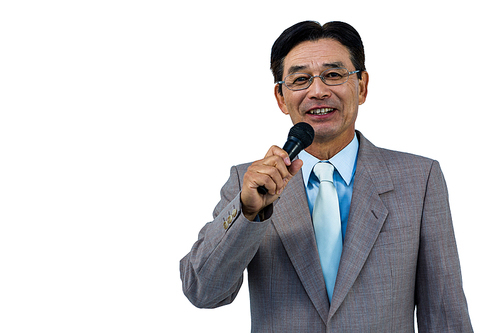 Asian businessman holding microphone on white background