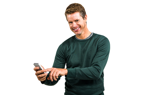 Portrait of smiling man using mobile phone while standing on white background