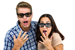 Portrait of shocked couple against white background