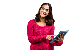 Portrait of beautiful young woman pointing at digital tablet against white background