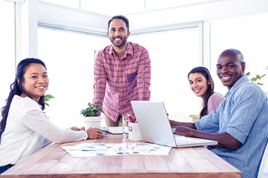 Happy multi ethnic business people in meeting room at creative office