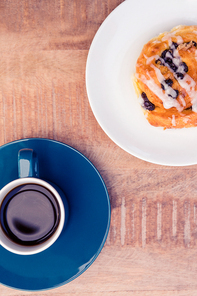 High angle view of sweet food served in plate by coffee cup on table at office