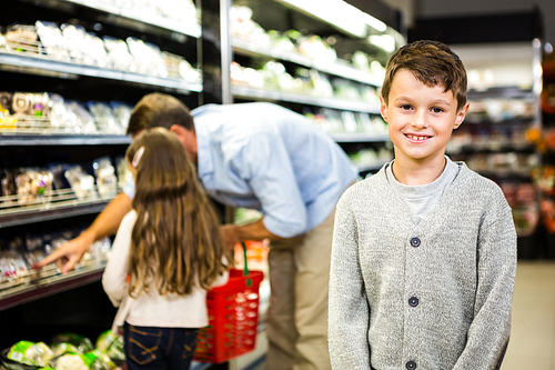 Father and kids at the grocery store together