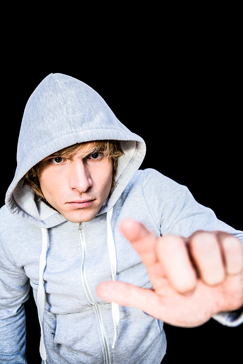 Man in hood jacket on black background